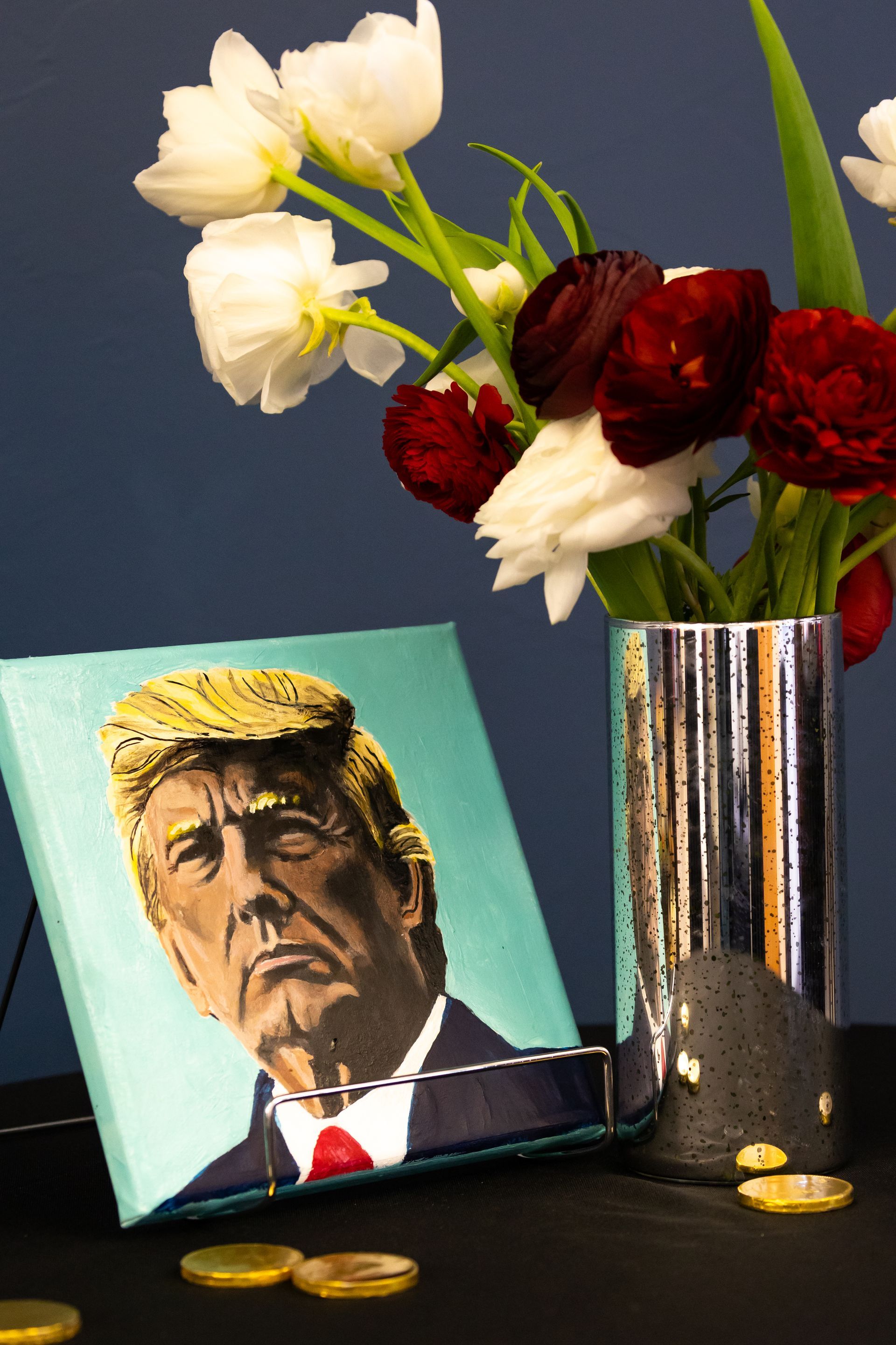Canvas print of President Trump next to a vase of red and white roses
