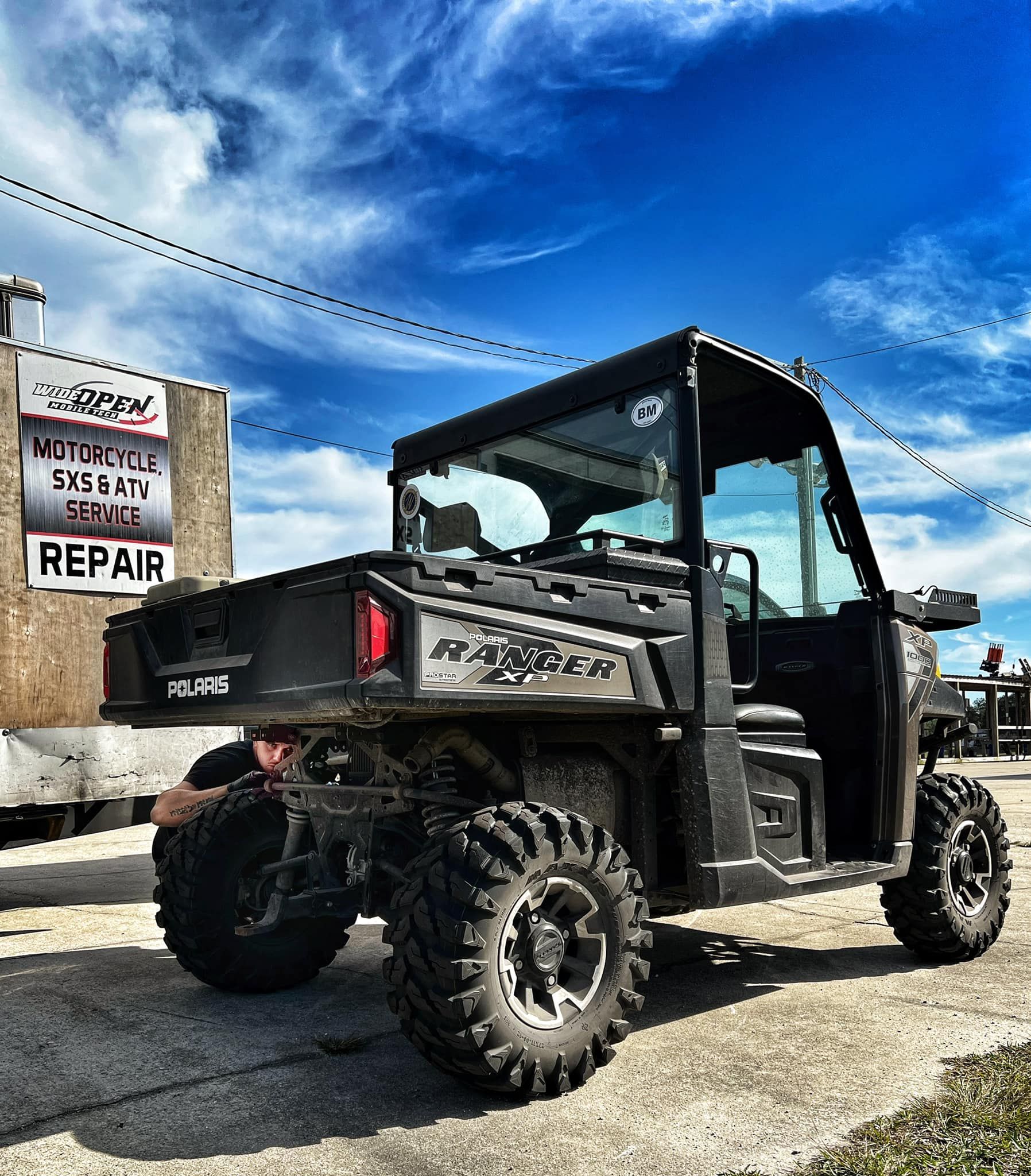 A Polaris ranger is parked in front of a building — St. Augustine, FL — Wide Open Mobile Tech