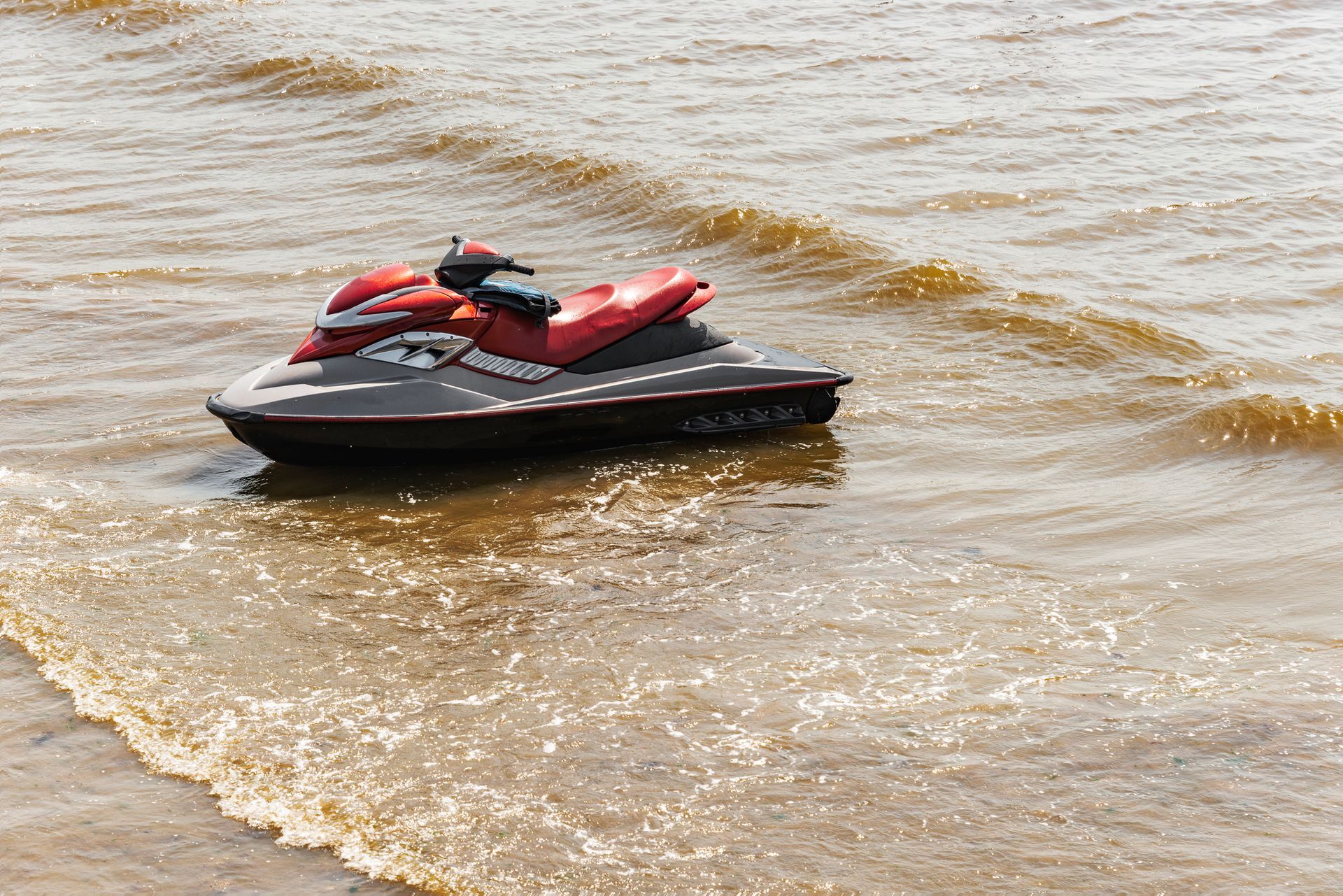 An ATV is parked next to a truck in a grassy yard — St. Augustine, FL — Wide Open Mobile Tech