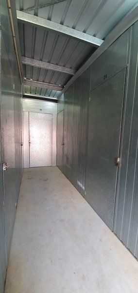 A Long Hallway With a Lot of Doors and a Roof — Tableland Self Storage In Atherton, QLD