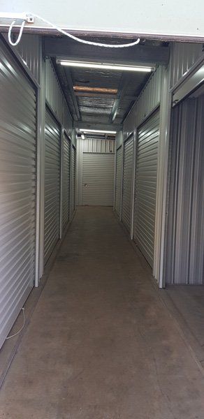 A Long Hallway Filled With Lots of Empty Storage Units — Tableland Self Storage In Atherton, QLD