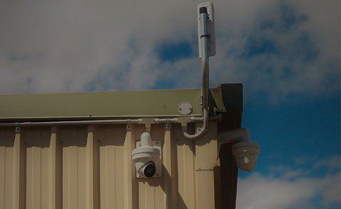 A Security Camera is Mounted on the Side of a Building — Tableland Self Storage In Atherton, QLD