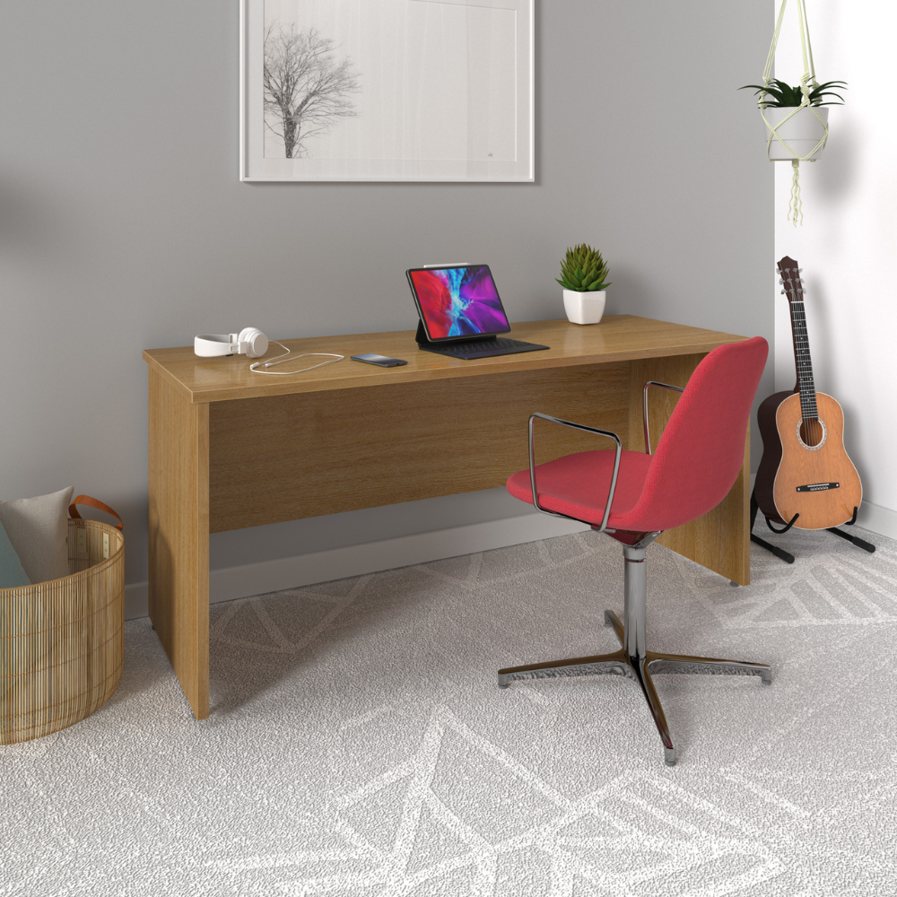 a wooden desk with a laptop and a red chair in a room .