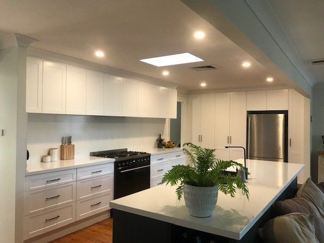 Clean White Modern Kitchen with Colorful Mid Century Modern Kitchen Chairs | Castle Hill, Nsw | Galaxy Kitchens & Bathrooms