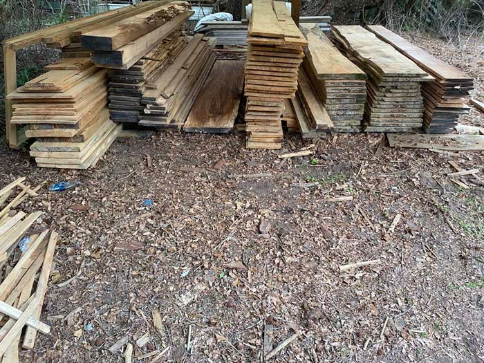 A pile of wood is stacked on top of each other