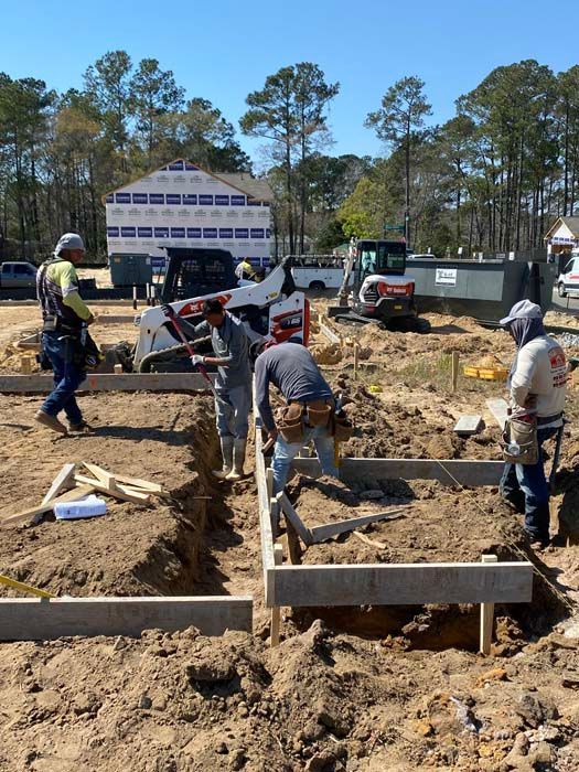 A group of construction workers are working on a construction site.