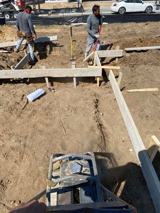 A group of construction workers are working on a construction site.