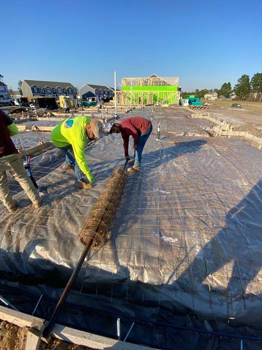 A group of construction workers are working on a construction site.