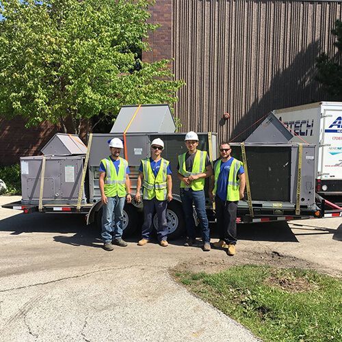 Air Conditioners are sitting on top of a Building - Elmhurst, IL - Airtech Heating & Cooling Corp