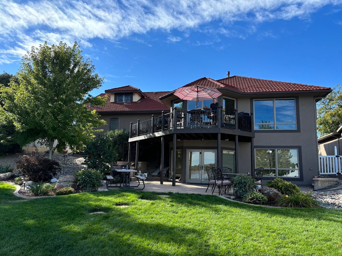 A large house with a large lawn in front of it.
