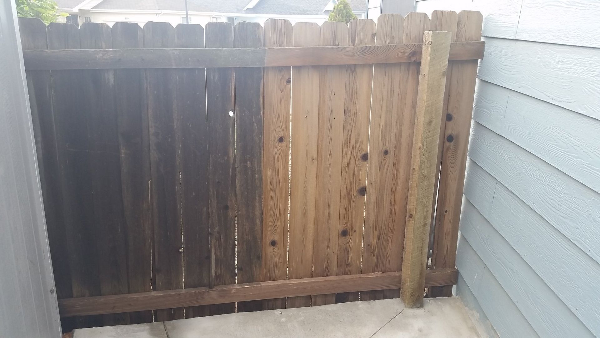 A before and after picture of a wooden fence.