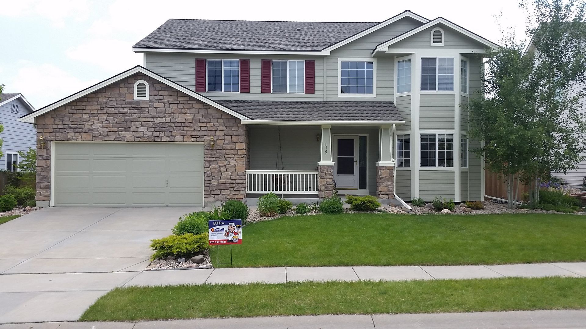 A large house with a sign in front of it that says ' for sale '