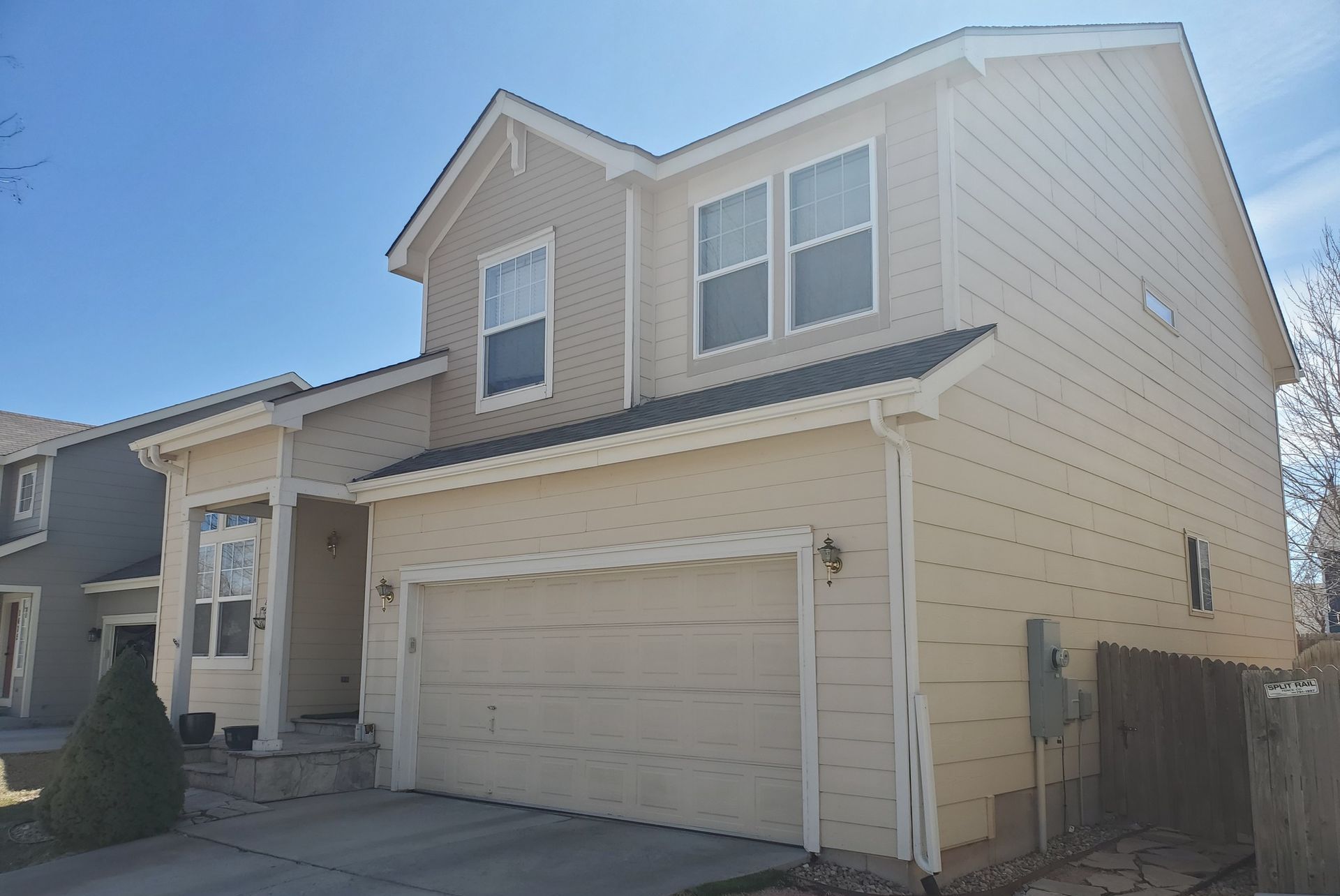 A house with a garage and a lot of windows
