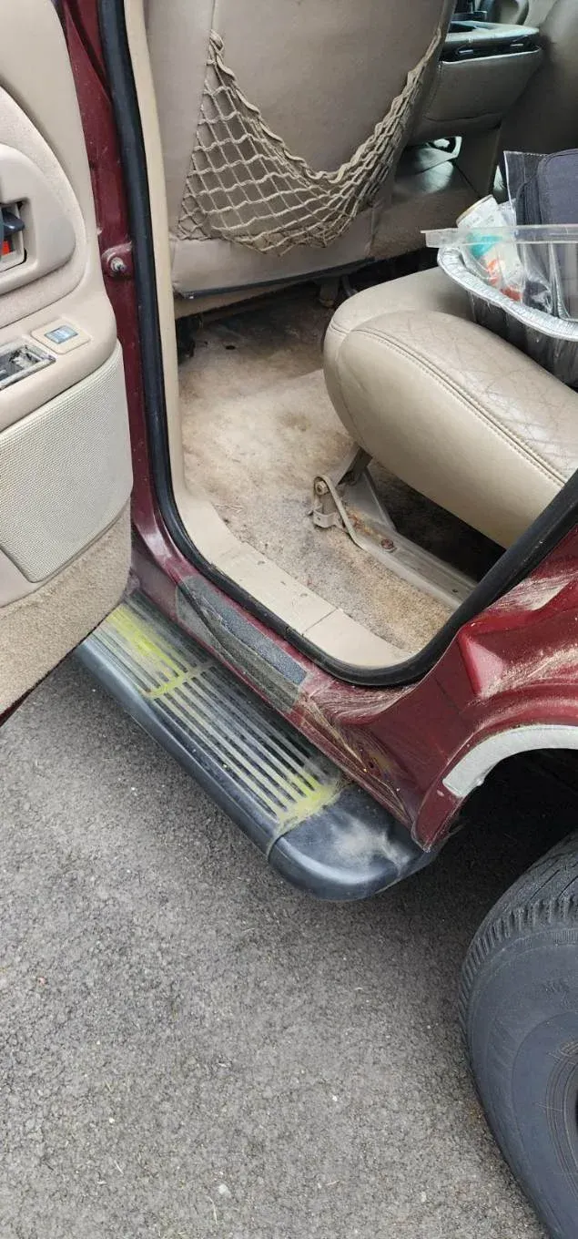 A close up of the inside of a car with the door open.