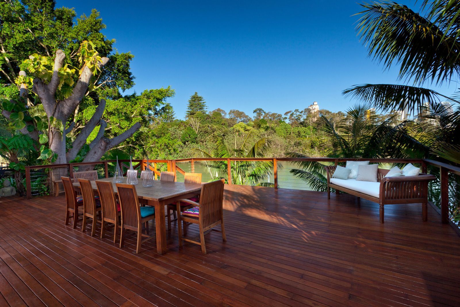 A wooden deck with a table and chairs on it