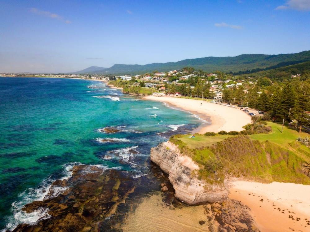 An Aerial View Of A Beach With A City In The Background — Loretta Davison Financial Solutions In Austinmer, NSW 