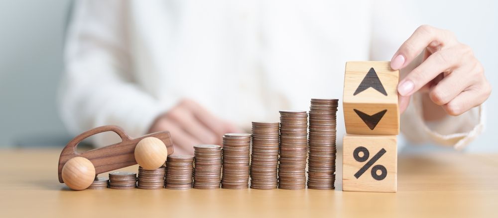 A Woman Is Handing A Car Key To Another Woman — Loretta Davison Financial Solutions In Shellharbour, NSW 