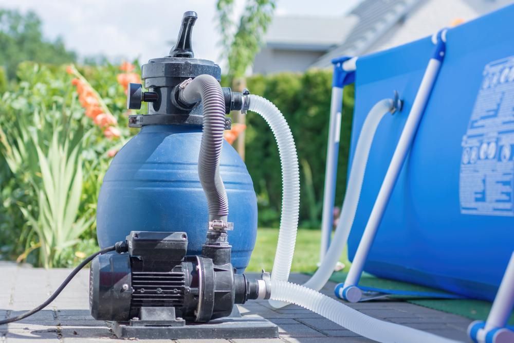 A Sand Filter is Attached to a Swimming Pool — Whitsunday Pool Service in Cannonvale, QLD