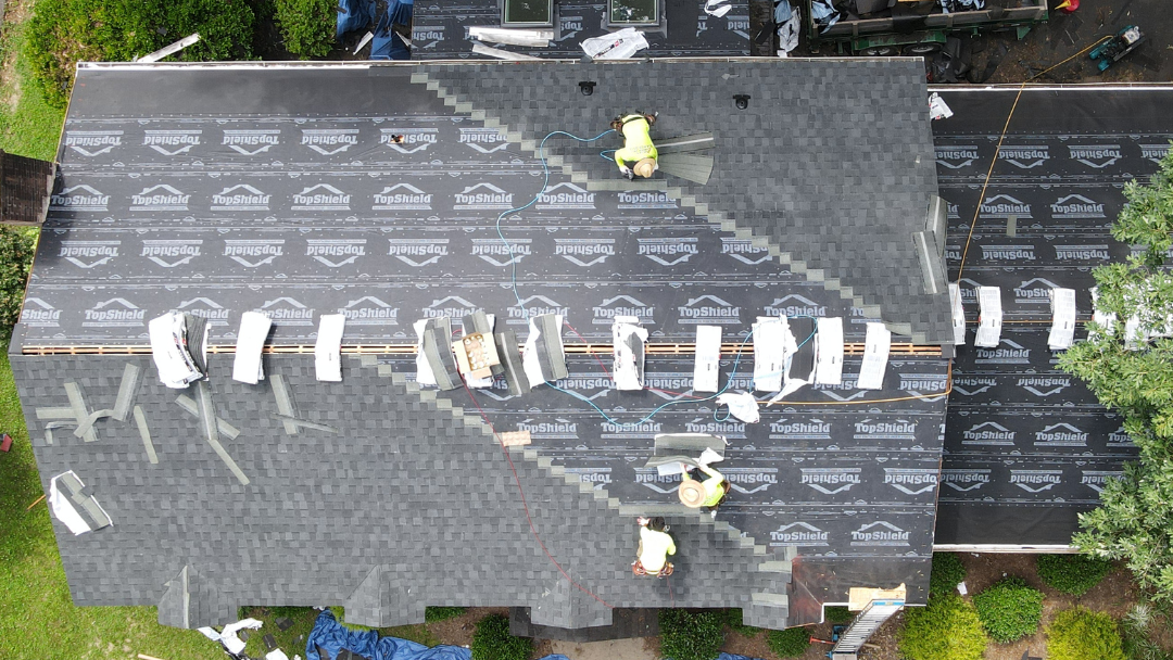 Drone aerial image of a North Chesterfield home where RETEX crew members are installing a new asphalt shingle roof. 