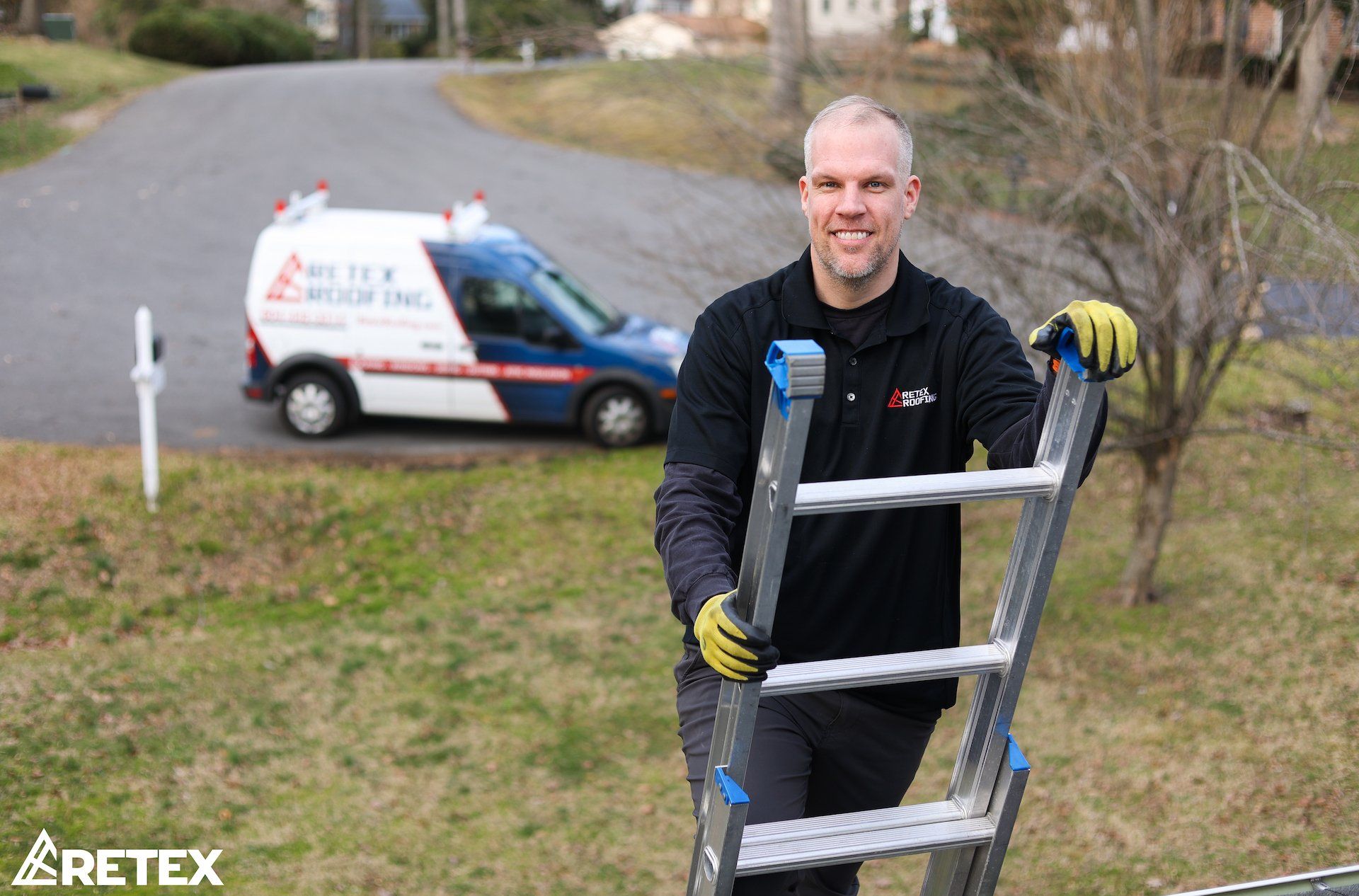 Portrait image of RETEX's Mark Erickson on ladder. RETEX van in background. 