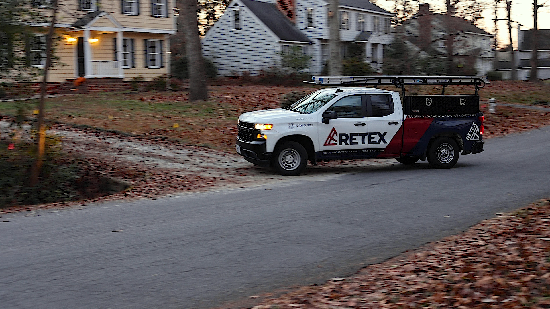 Image of RETEX branded truck pulling into North Chesterfield VA home's driveway. 