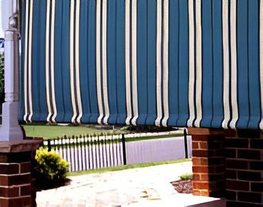 Blue And White Striped Awning Covering A Porch — Winning Blinds in Cardiff, NSW