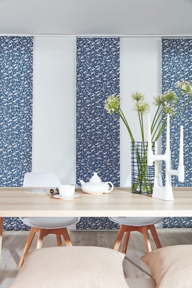 A Dining Room Table With A Vase of Flowers and Candles on It — Winning Blinds in Port Stephens, NSW