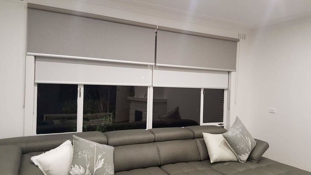 Gray Window Shades, Partially Lowered, Over A Sofa — Winning Blinds in Cardiff, NSW