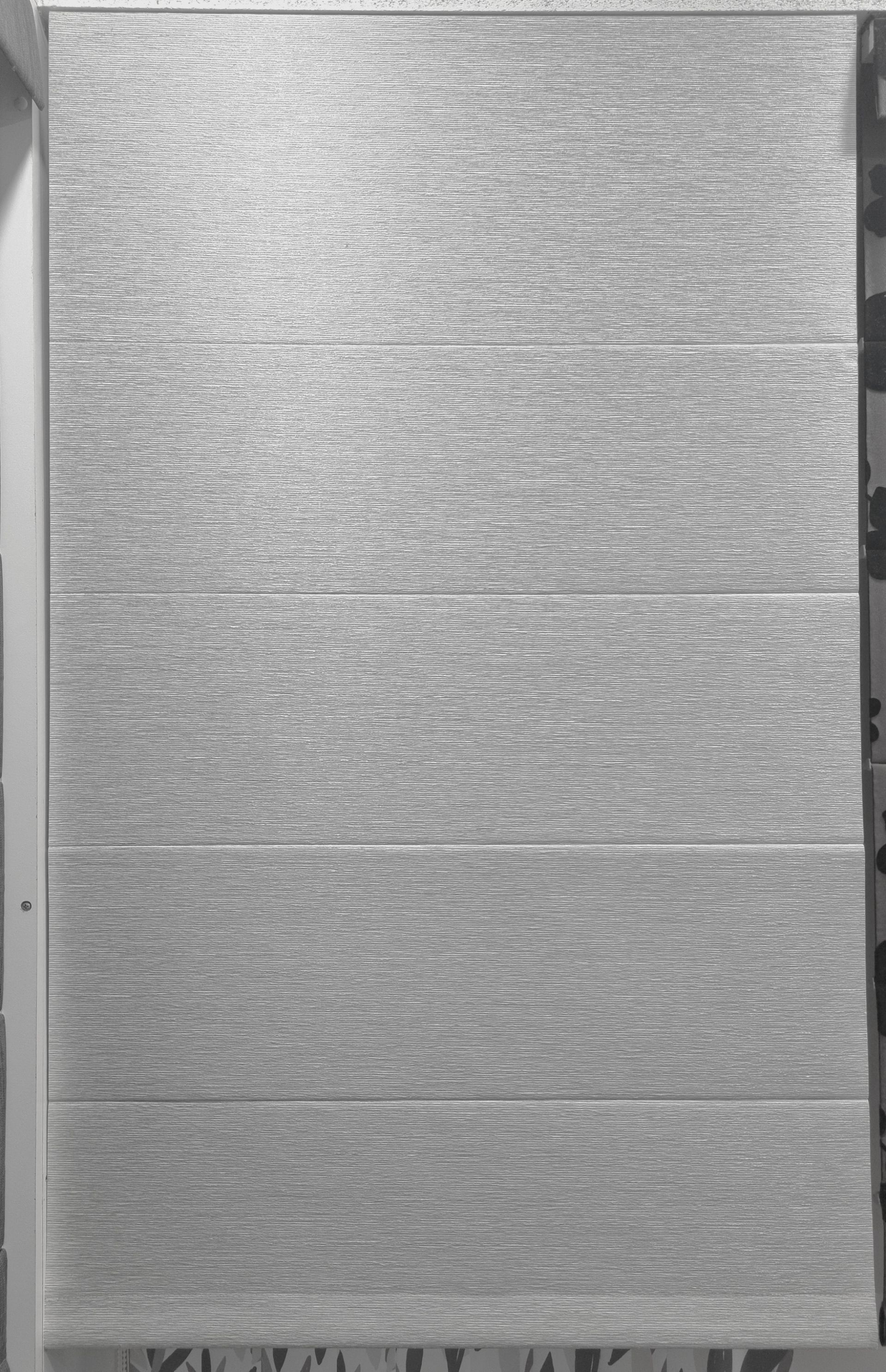 An off white roman blind with white wooden skirtings around it — Winning Blinds in Cardiff, NSW