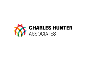 The logo for charles hunter associates is a rainbow colored circle.