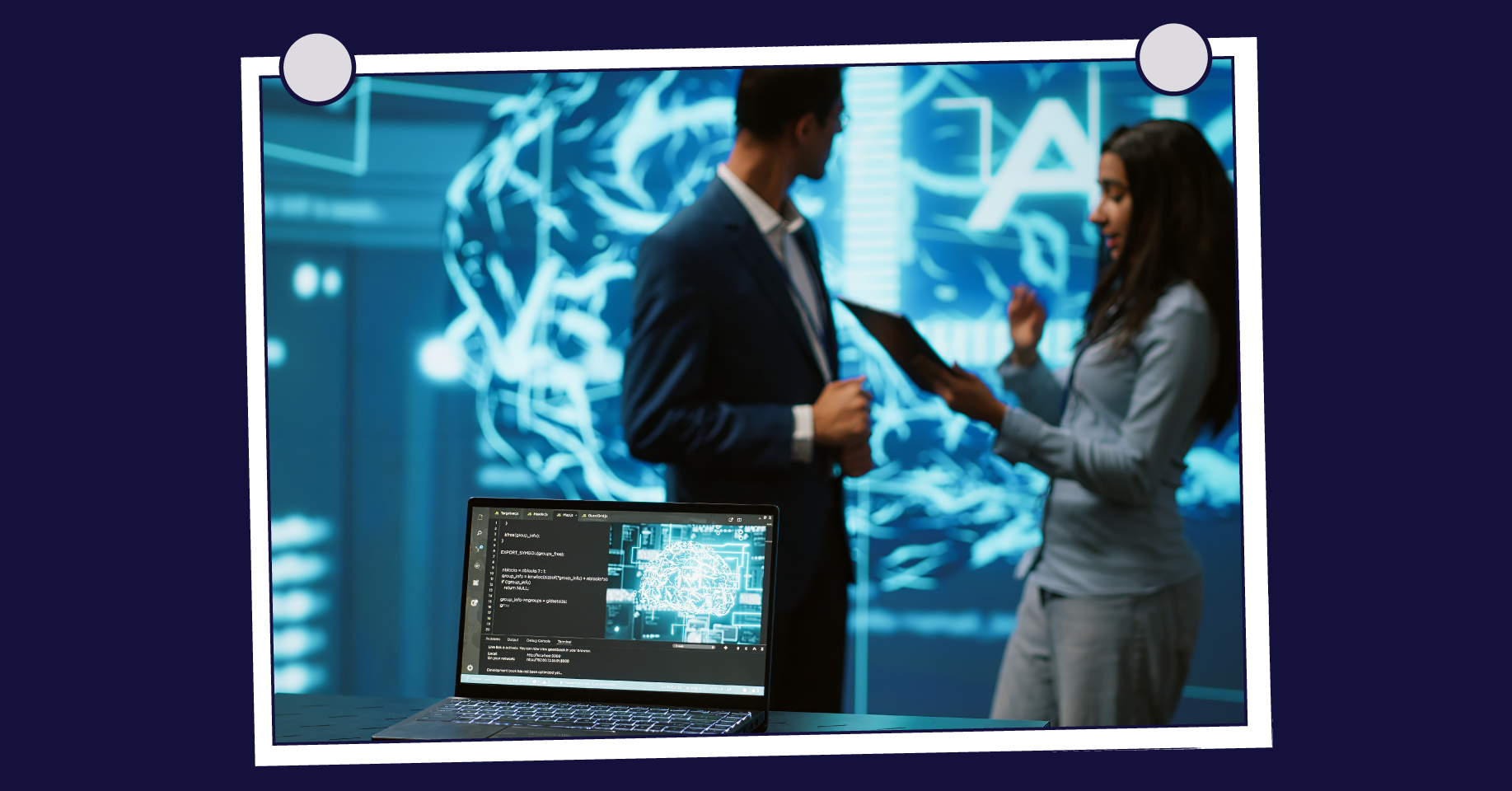 Two professionals discussing AI with laptop in foreground