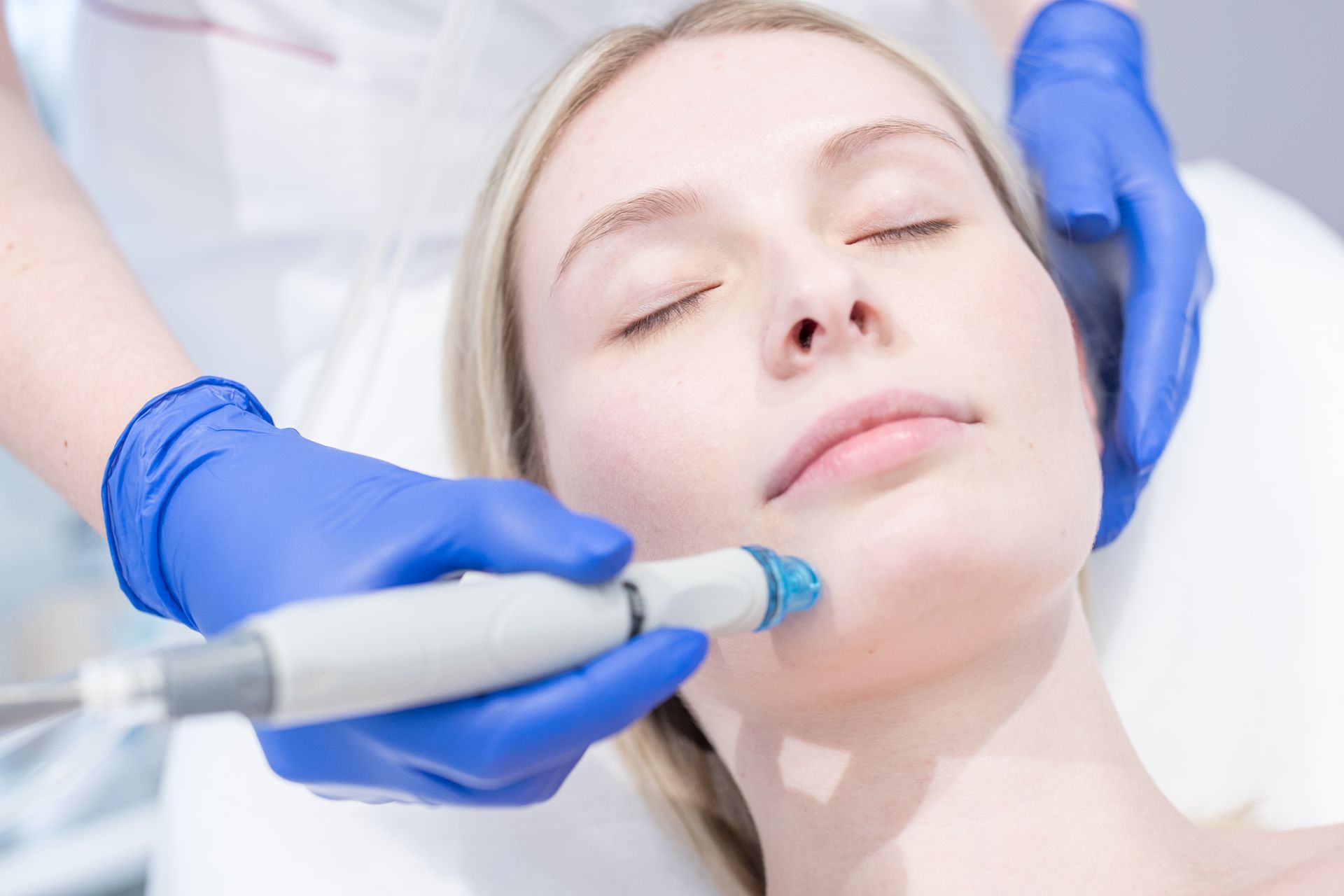 A Woman Is Getting A Facial Treatment At A Beauty Salon — Harrisburg, PA — Rise Hair Studio