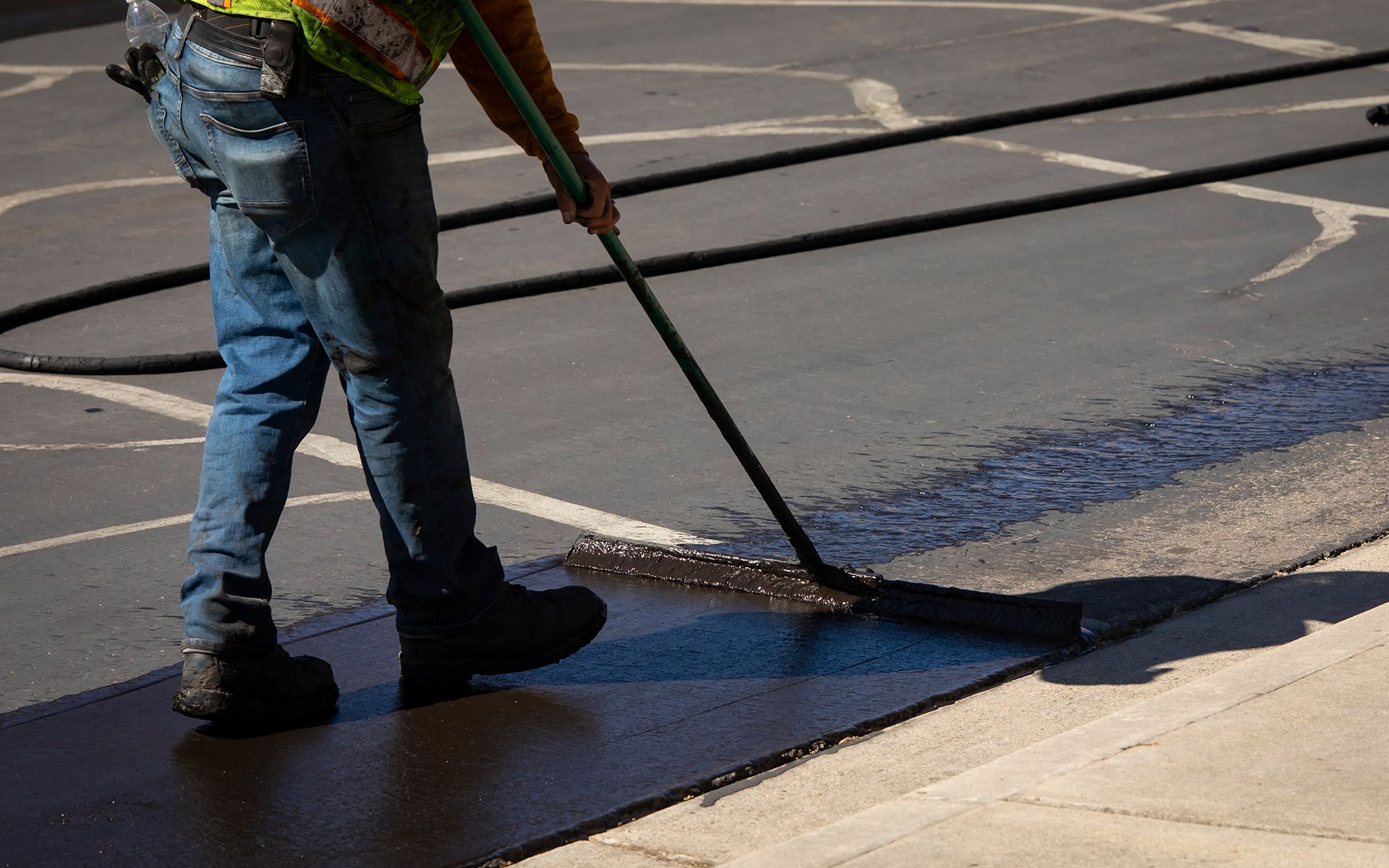 Worker Sealcoating — Worcester, MA — Minutemen Paving