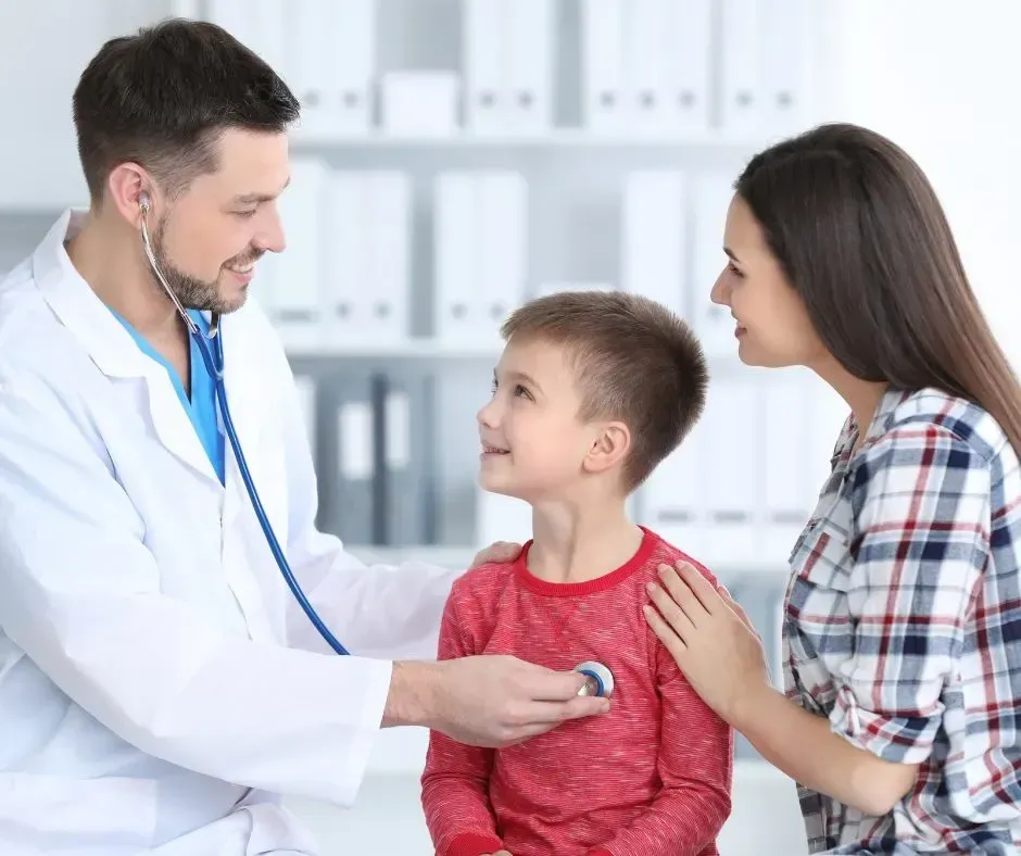 Doctor listens to a child’s chest with a stethoscope in the clinic
