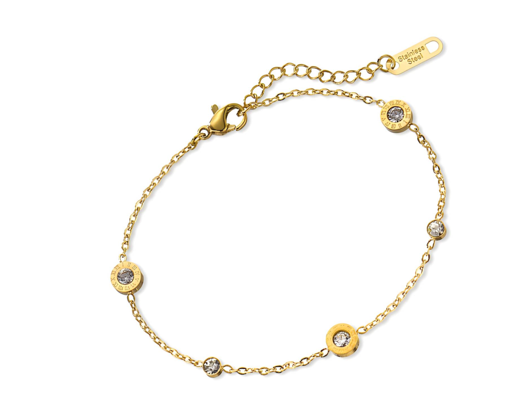 Goudkleurige armband met ronde, transparante edelstenen en Romeinse cijfers.