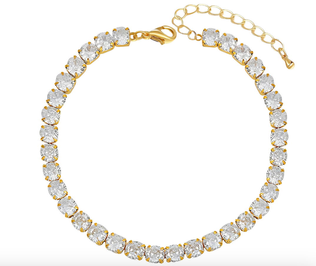 Gouden armband met heldere, ronde edelstenen.