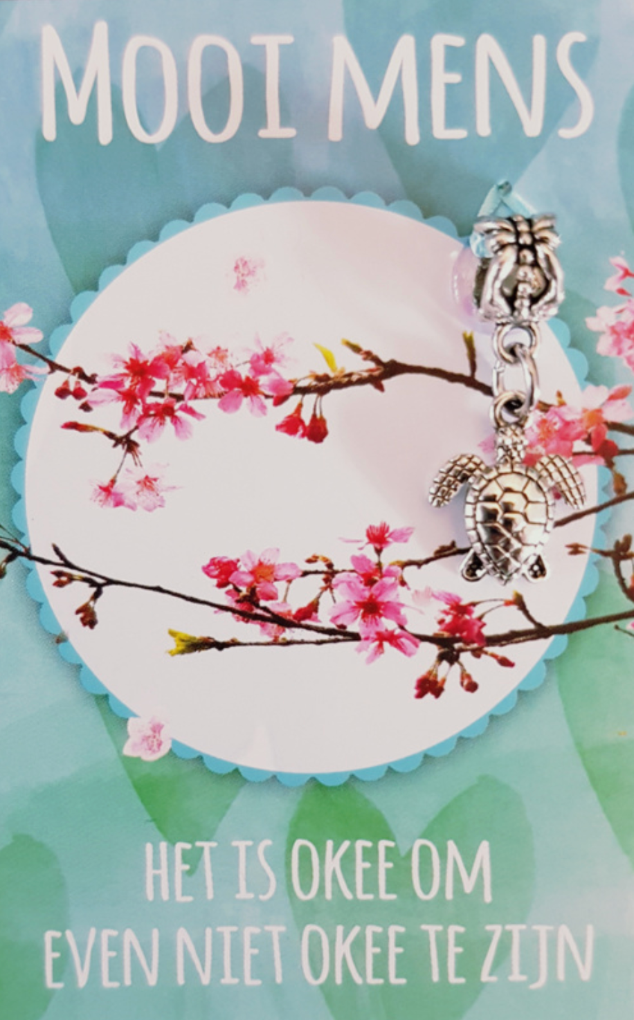 Greeting card with a turtle charm. Text reads 