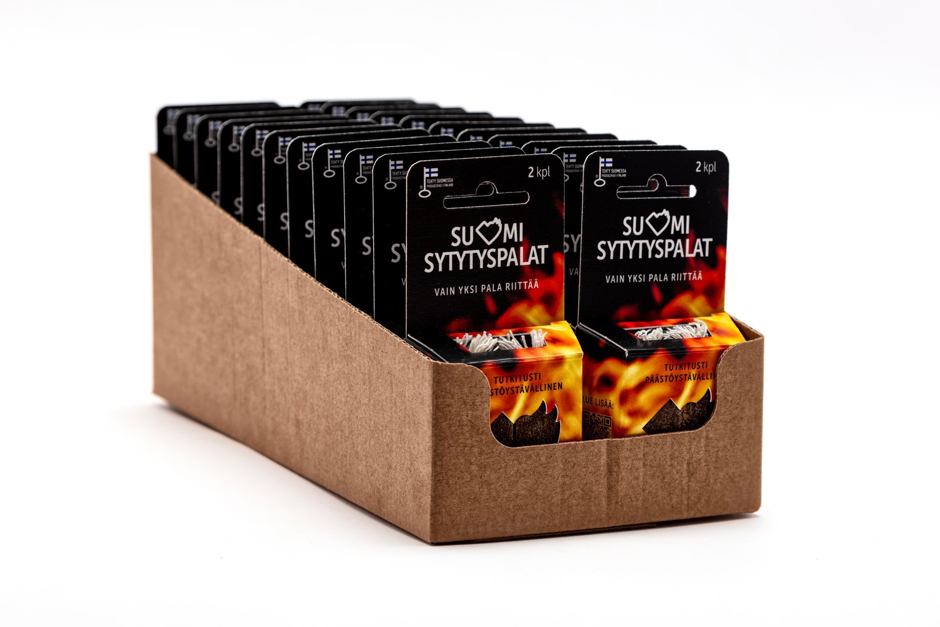 A cardboard box filled with packets of Suomi Sytytyspalat