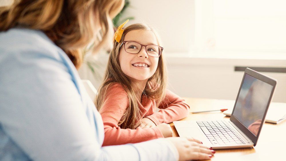 Mother and Daughter Having Fun with Laptop — Summerville, SC — Shepherd Law Firm, LLC