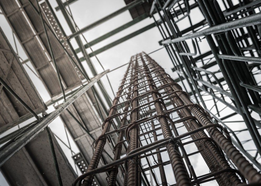 Looking Up At A Tall Metal Structure With Stairs Leading Up To It — Fahlstrom Scaffolding Cairns Pty Ltd in Gordonvale, QLD