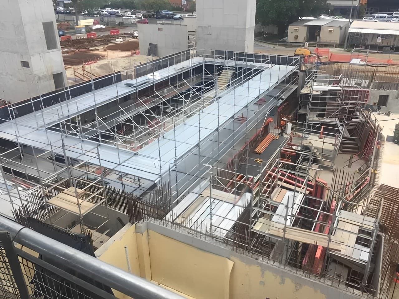 An Aerial View Of A Construction Site With Scaffolding On The Roof — Fahlstrom Scaffolding Cairns Pty Ltd in Gordonvale, QLD