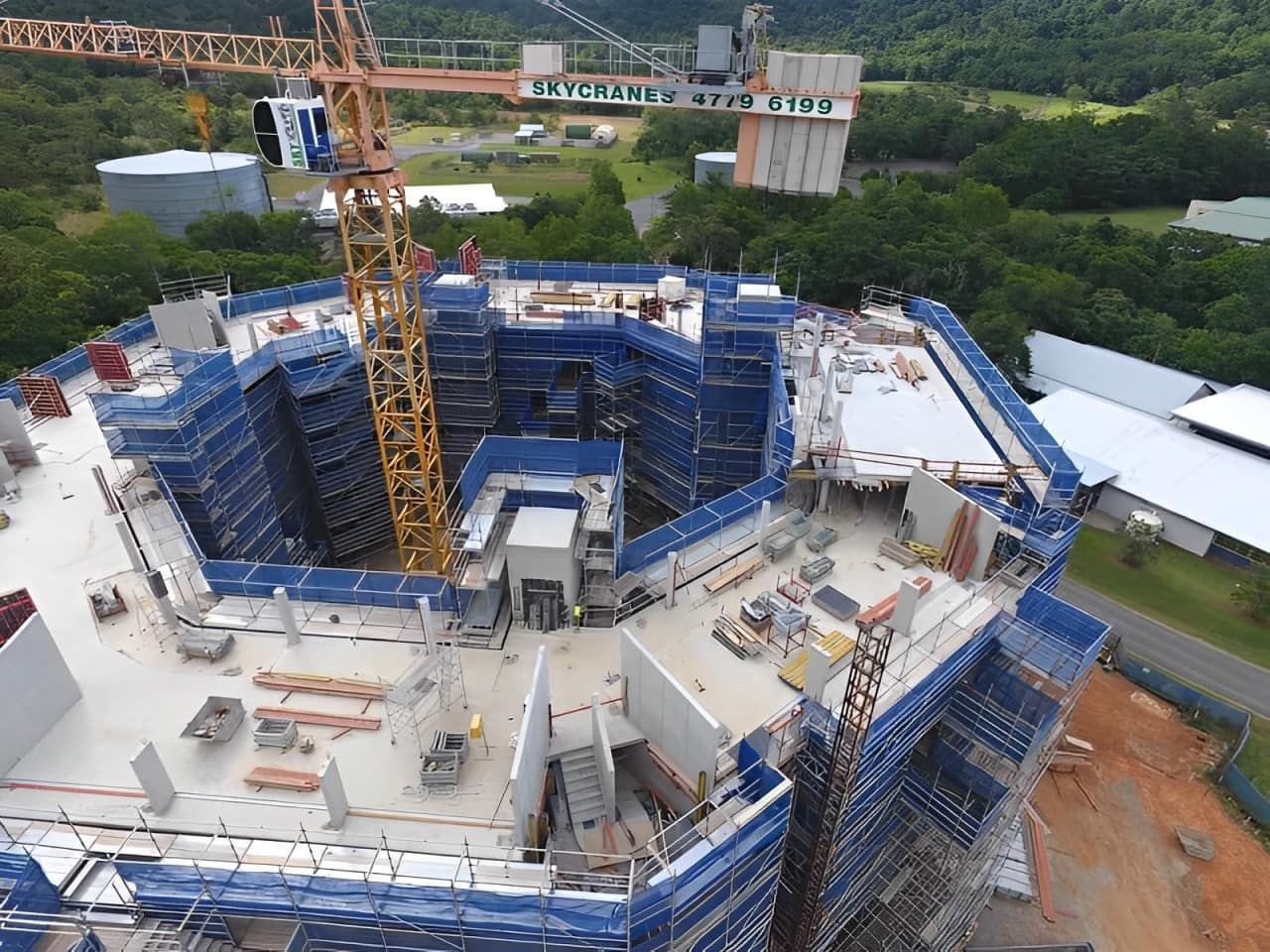 An Aerial View Of A Large Building Under Construction — Fahlstrom Scaffolding Cairns Pty Ltd in Gordonvale, QLD