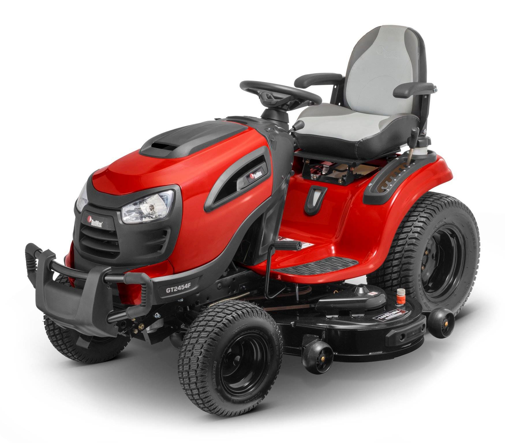 A Person is Riding a Lawn Mower on a Lush Green Field — Stockers & Partridge In Dungog, NSW