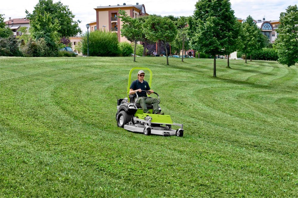 A Person is Riding a Lawn Mower — Stockers & Partridge In Paterson, NSW