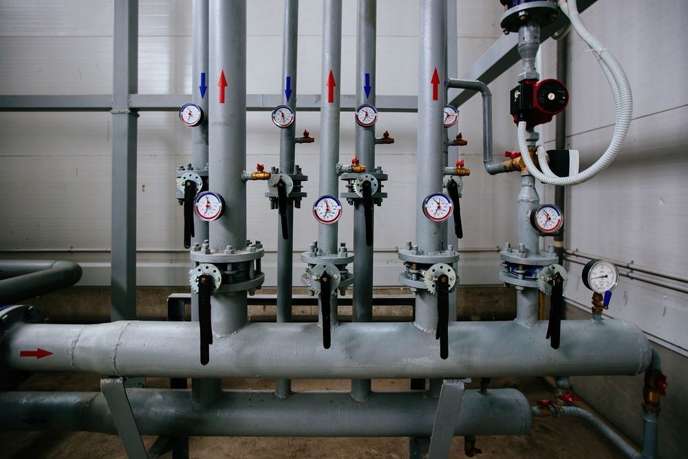 A Bunch of Pipes and Valves Are Lined Up in a Room — Stockers & Partridge In Pokolbin, NSW