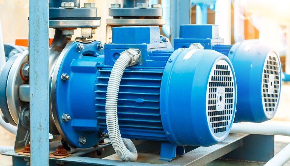 A Blue Electric Motor is Sitting on Top of a Metal Structure — Stockers & Partridge In Raymond Terrace, NSW
