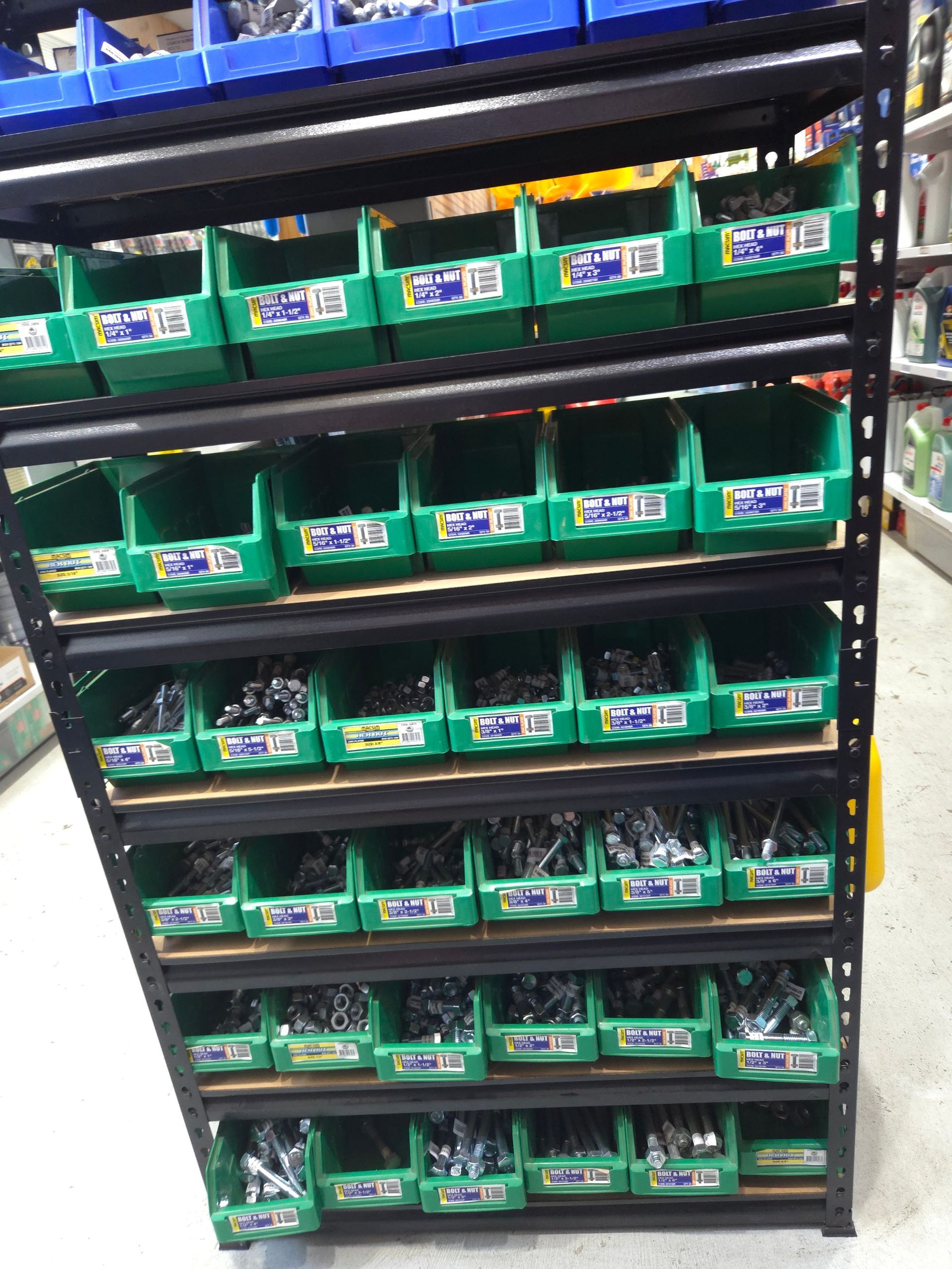 A Shelf Filled With Lots of Green Bins — Stockers & Partridge In Paterson, NSW