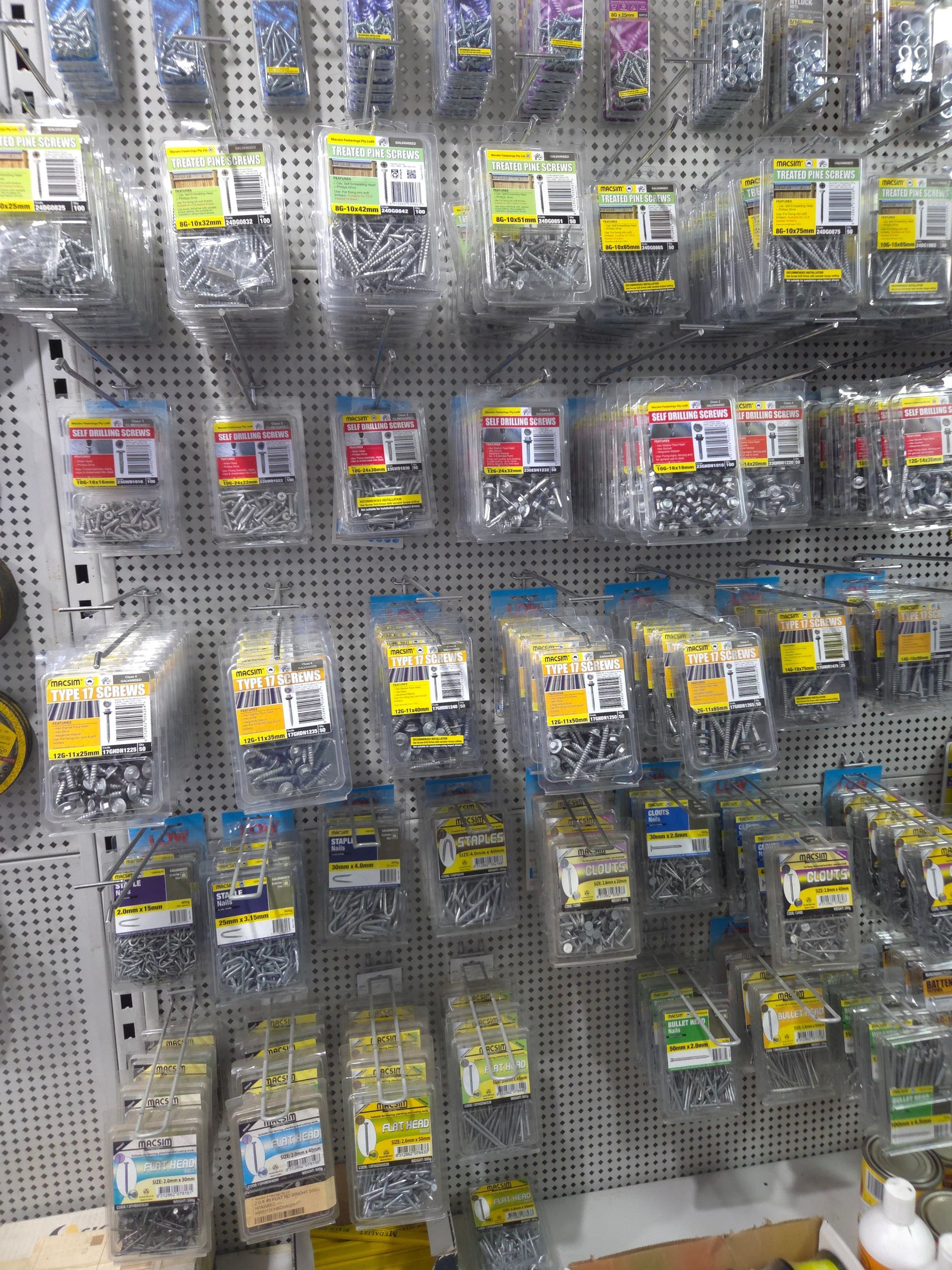 A Wall Filled With Lots of Different Types of Screws — Stockers & Partridge In Paterson, NSW