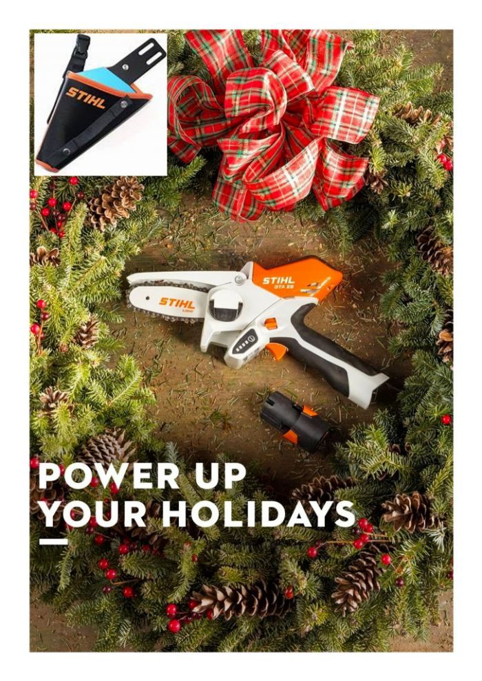 A Stihl Cordless Chainsaw is Sitting on Top of a Christmas Wreath — Stockers & Partridge In Paterson, NSW A Stihl Cordless Chainsaw is Sitting on Top of a Christmas Wreath — Stockers & Partridge In Paterson, NSW