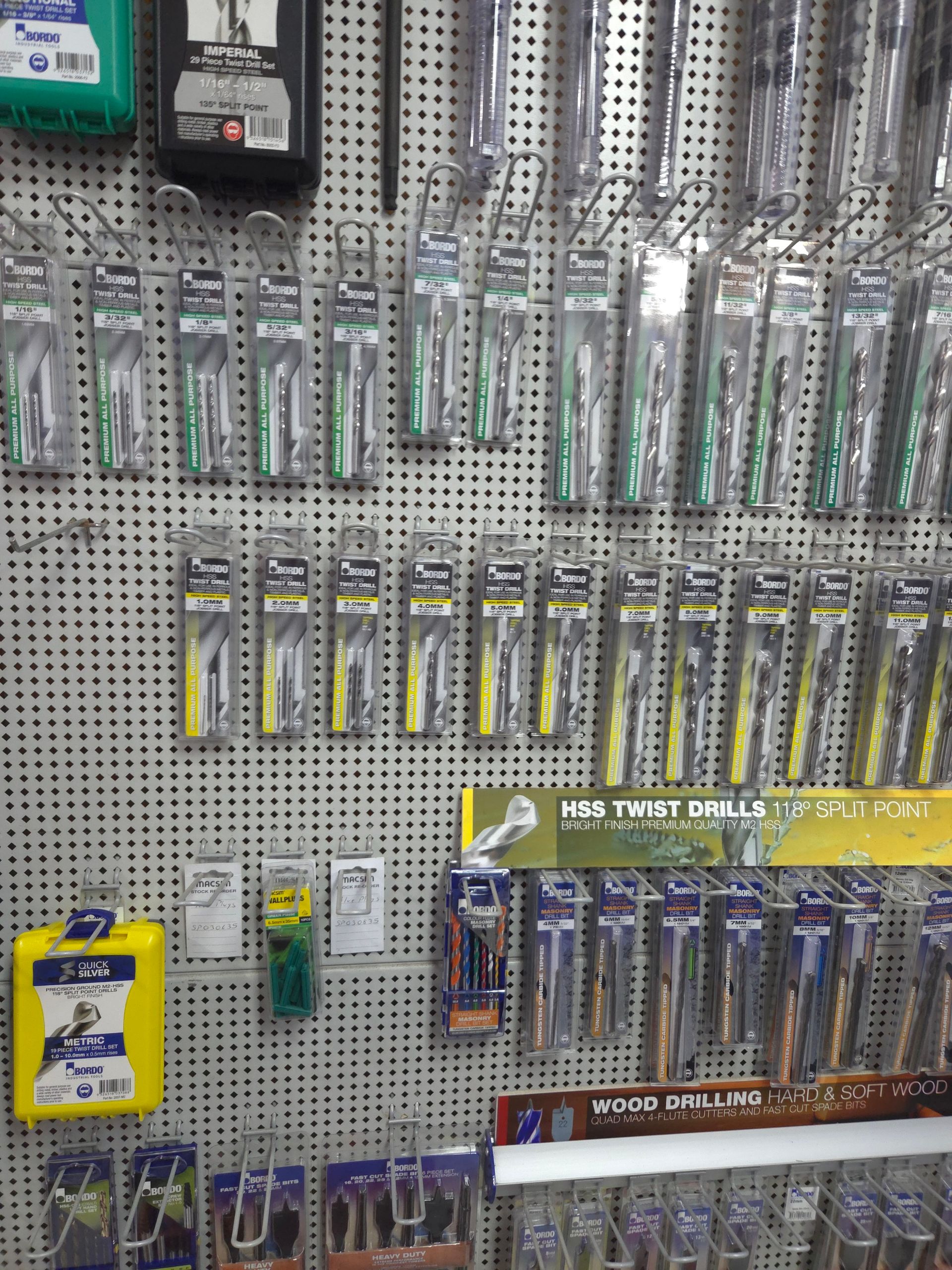 A Bunch of Drill Bits Are Hanging on a Wall — Stockers & Partridge In Paterson, NSW